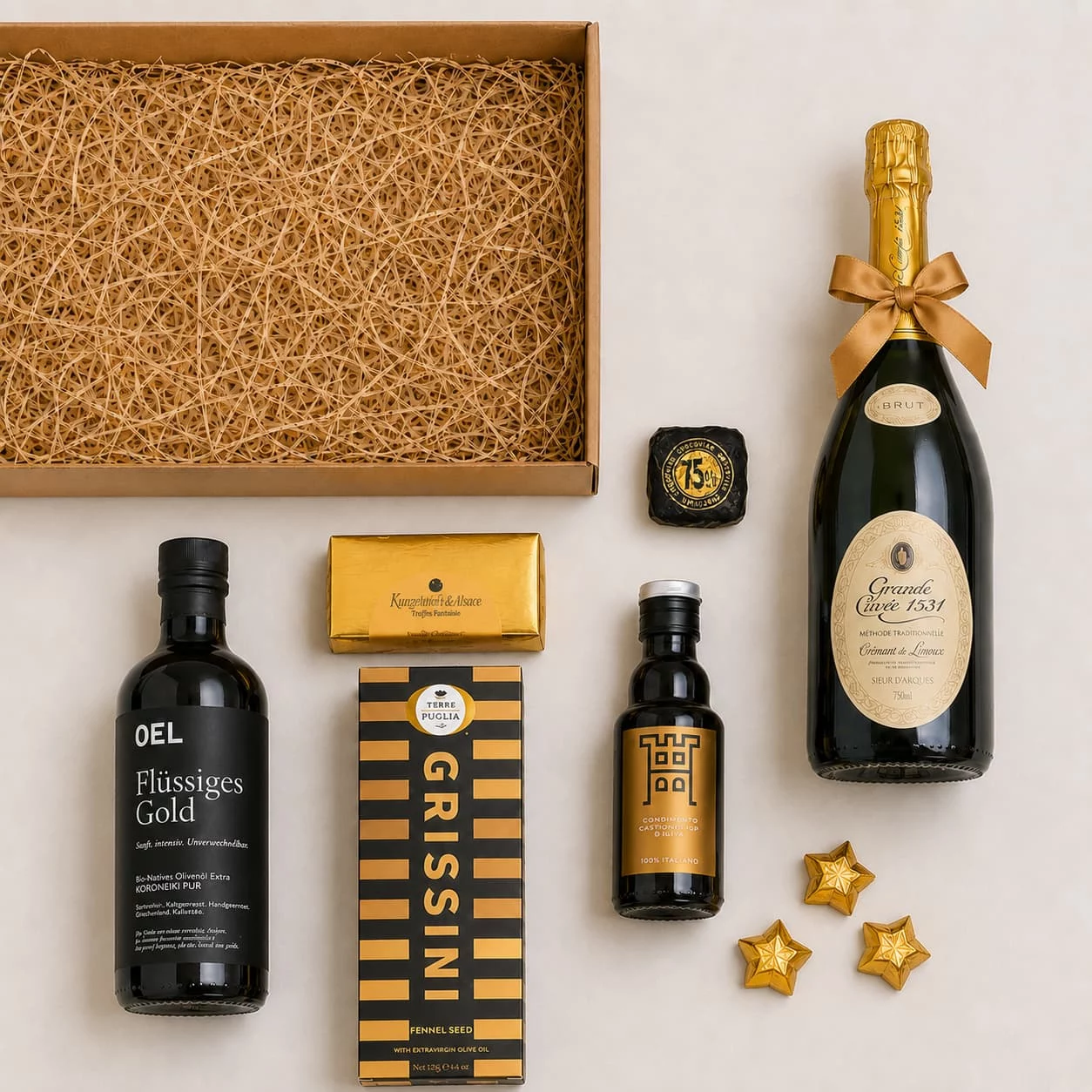 Inhalt des Präsentkorbs mit Crémant de Limoux, Grissini und Kakaokonfekt
