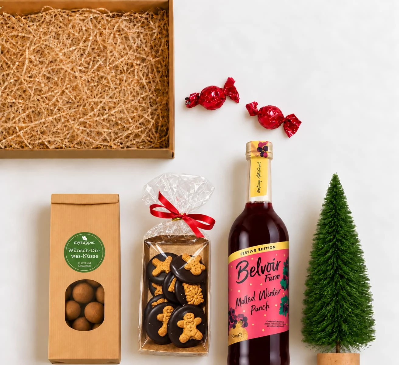 Inhalt des Punsch-Geschenksets: Belvoir Farm Mulled Winter Punch, Wünsch-Dir-Was-Nüsse, Spekulatius und Pralinen